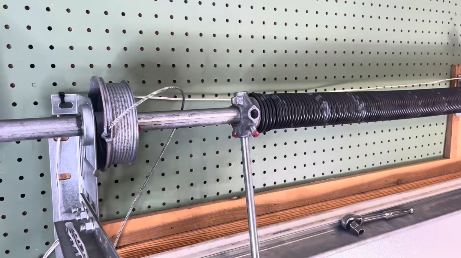 Garage door repair cost Franklin — technician setting spring tension safely